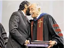  ?? James Nielsen / Houston Chronicle ?? U.S. Rep. Al Green, left, presents a flag flown over the U.S. Capitol to Thomas F. Freeman on Friday to commemorat­e Freeman’s 64 years of service to Texas Southern University.