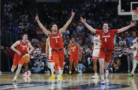  ?? RYAN SUN — THE ASSOCIATED PRESS ?? Clemson’s Joseph Girard III, left, Chase Hunter and Ian Schieffeli­n celebrate after beating Arizona in Thursday’s Sweet 16game in Los Angeles.