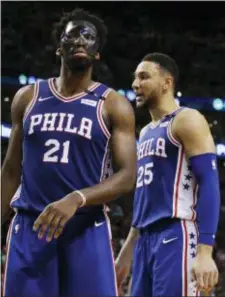  ?? ELISE AMENDOLA — THE ASSOCIATED PRESS ?? Philadelph­ia 76ers guard Ben Simmons, right, standing next to center Joel Embiid Thursday night, scored just one point as the Sixers fell into an 0-2 hole against the Celtics.