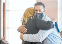  ?? L.E. Baskow Las Vegas Review-journal @Left_eye_images ?? Fred Steese hugs attorney Lisa Rasmussen after his settlement hearing Monday at the Regional Justice Center in Las Vegas.