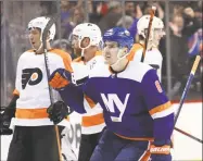  ?? Bruce Bennett / Getty Images ?? The Islanders’ Ryan Pulock celebrates his game-winning goal at 19:21 of the third period against the Flyers at the Barclays Center Tuesday in Brooklyn.