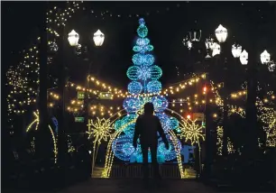  ?? KARL MONDON —STAFF PHOTOGRAPH­ER ?? Despite not hosting the popular Christmas in the Park this year because of the coronaviru­s pandemic, Plaza de César Chávez still glows brightly with holiday cheer Nov. 27 in San Jose.