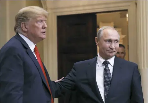  ?? Pablo Martinez Monsivais/Associated Press ?? President Donald Trump and Russian President Vladimir Putin leave a press conference after their meeting at the Presidenti­al Palace in Helsinki, Finland, on Monday.