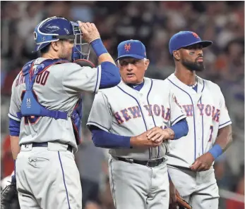  ?? JASON GETZ, USA TODAY SPORTS ?? Mets manager Terry Collins, center, has seen his starting rotation get battered by injuries.