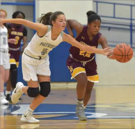  ?? PETE BANNAN — DIGITAL FIRST MEDIA ?? Great Valley’s Ashley Sullivan (5) and Avon Grove’s Kaelin Salley (22) chase down a ball in the first quarter at Great Valley Friday evening.