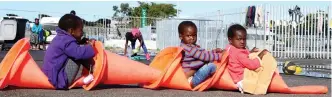  ?? | BRENDAN MAGAAR African ews Agency (ANA) ?? REFUGEE children use traffic cones to create a pretend bus at Paint City in Bellville.