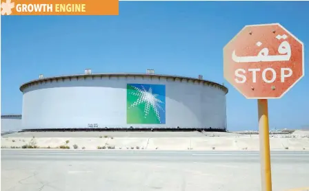  ??  ?? An Aramco tank is seen at Saudi Aramco’s Ras Tanura oil refinery and oil terminal in Saudi Arabia. — Reuters