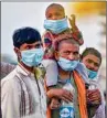  ??  ?? Migrants at Ghazipur border on their way to their native places, in New Delhi, on Friday PTI