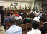  ?? AP PHOTO BY OMAR AKOUR ?? A military court convenes in the case of a Jordanian soldier accused of shooting to death three U.S. military trainers at the gate of an air base, in Amman, Jordan, Monday.