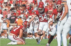  ?? BRYAN TERRY/THE OKLAHOMAN ?? OU’s Zach Schmit kicks an extra point during a game against UTEP at Gaylord Family-Oklahoma Memorial Stadium in Norman on Sept. 3.