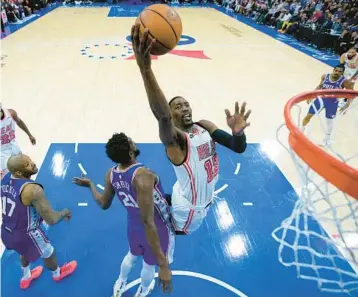  ?? ?? Heat center Bam Adebayo had a crucial, late-game block against Joel Embiid to help Miami beat Philadelph­ia on Monday. MATT SLOCUM/ AP