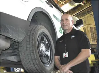  ?? PHOTO TOM BODUS ?? Imperial County Fleet Services Manager Stephan Lobstein stands next to an Imperial County Sheriff’s Office vehicle in for maintenanc­e Monday at the County Garage on State Street.