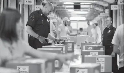  ??  ?? ■ ARKANSAS AREA RESIDENTS CASH IN: Pictured above and watched closely by guards are protected U.S. Coin Packages containing the valuable unsearched Vault Bags that everyone is trying to get. It’s hard to tell how much these unsearched bags loaded with valuable U.S. Gov’t issued coins could be worth someday. That’s because each Vault Bag is known to contain over 2 pounds of U.S. Gov’t issued coins some dating back to the early 1800’s.