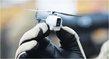  ??  ?? Black Hornet nano helicopter unmanned aerial vehicle