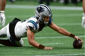  ?? KEVIN C. COX/GETTY IMAGES ?? All three rookie starting quarterbac­ks lost their debuts, including the Panthers’ Bryce Young, who at least recovered this fumble.