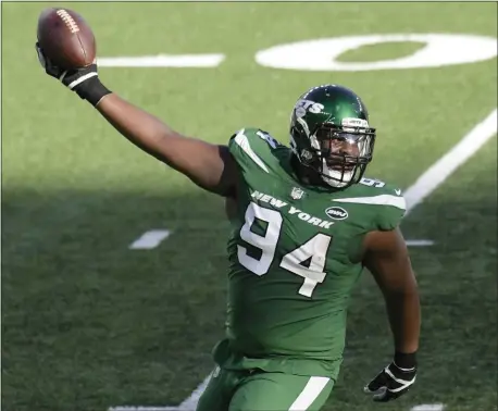  ?? BILL KOSTROUN — THE ASSOCIATED PRESS ?? Jets defensive tackle Foley Fatukasi celebrates after recovering a fumble during the first half of Sunday’s game against the Cleveland Browns.