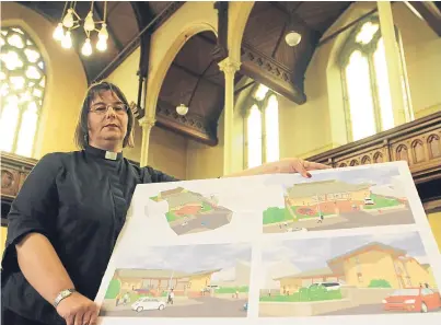  ?? Picture: Mhairi Edwards. ?? The Rev Maggie Hunt in St Margaret’s Church with plans for the centre.