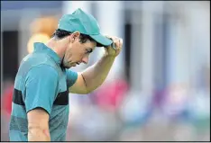  ?? STUART FRANKLIN / GETTY IMAGES ?? Rory McIlroy reacts after bogeying the 18th and missing the cut by a shot. McIlroy said his putting at Baltusrol was “just pathetic.”