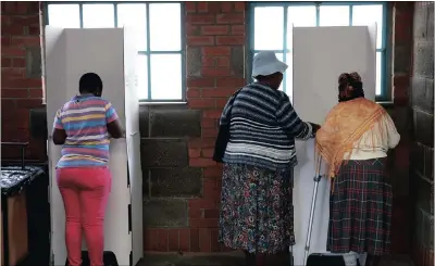  ?? PICTURE: REUTERS ?? A woman gets help while casting her vote. After the voting the real action takes place as parties try to make coalitions to grab power. And in many cases, voters will be reduced to helpless spectators.