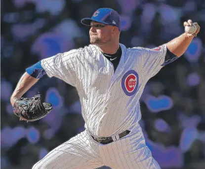  ??  ?? Jon Lester struck out seven and walked none in five scoreless innings against the Reds on Saturday. | JIM YOUNG/ AP