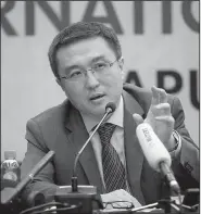  ?? AP/AARON FAVILA ?? Wang Xiaolong, a member of the Chinese delegation at the APEC summit in Port Moresby, Papua New Guinea, answers questions from reporters Sunday.