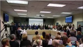  ?? DAN SOKIL — MEDIANEWS GROUP ?? North Penn High School swim coach Selma Robinson, at podium, introduces members of the high school girls and boys swimming and diving teams to be recognized by the district school board on April 11. Girls team members recognized by the board include Maureen Boland Bintner, Abigail Broadhead, Paige Burrell, Nicole Chiappa, Kaelan Daly, Julia Davis, Caroline Dunigan, Madalyn Freece, Madison Fritz, Katelyn Harkrader, Luna Hutchinson, Elizabeth Koerper, Haley Muth, Abigail Peters, Parker Schulz, Julia Stephens, Charlotte Thamm, Claudia Thamm, Olivia Toussaint, Madeleine Voss, Meghan Wenzel, Kianna Yancey, and Madeline Zartman.Boys team members recognized include Max Bachman, Paul Greyson Campbell, Nicholas Clark, Eric Degodny, Micah Detweiler, Luke Engel, Ryan Faikish, Sean Faikish, Ryley Fein, Robert Freece, Tyler Hall, Matthew Harkrader, Scott Klein, William Klein, Evan Mancini, Evan Meiers, Luke Schwar, Kyle Stressman, Sage Trautz, Nathan Wauls and Ryan Woolaver.