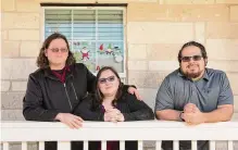  ?? Salgu Wissmath/staff photograph­er ?? Kate Chaney, center, is legally blind, and has been diagnosed with Asperger’s syndrome and lupus. She and husband Rob, left, founded Inspiratio­nal Experience­s. Bryan Espinoza is secretary.