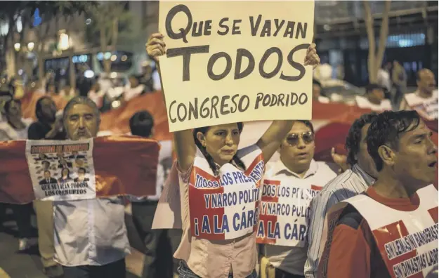  ?? PICTURE: ERNESTO BENAVIDES/AFP/GETTY IMAGES ?? ‘Throw them all out’ The message from protestors angry at the perceived corruption of all political parties in Peru