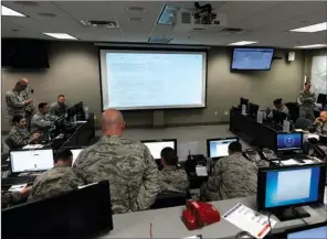  ?? U.S. AIR FORCE PHOTO BY AIRMAN RHRETT ISBELL ?? The Emergency Operations Center receives requests from the incident commander during an exercise and coordinate­s the support needed from agencies around the Little Rock Air Force Base on March 31.