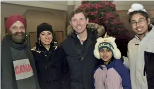  ??  ?? Surjit and his wife Gurvinder (left) and their daughter Gurleen and son Satnam (right) were among the many who attended a community Christmas gathering last year. Brampton’s current mayor Patrick Brown (centre) also took part in the festivitie­s.