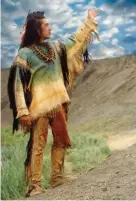  ??  ?? Actor Graham Greene wears one of Cathy Smith’s movie costumes in the 1990 film Dances With Wolves.