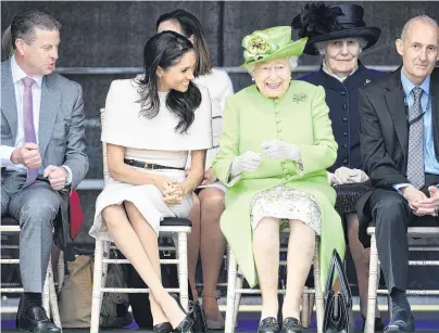  ?? PHOTO: GETTY IMAGES ?? The Queen is amused . . . Queen Elizabeth II laughs with the Duchess of Sussex during a ceremony to open the new Mersey Gateway Bridge yesterday in Cheshire, England. This was the Duchess of Sussex’s first engagement with the Queen.