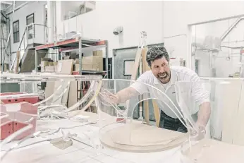  ??  ?? QUALITY CONTROL: Hans Kretschman, a former commercial banker, inspects a chair backing at the Plexi-Craft factory in New York. Kretschman bought the company in 2016.