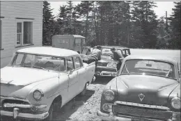  ?? Photo submitted by Scott Sheppard. ?? The date is June, 1960. The location is outside the office of Newhook & Morgan Engineerin­g on Topsail Road near Mount Carson Avenue. The vehicles are a Plymouth (or is it a Dodge?), Vauxhall, Ford and Land Rover. Perhaps a ‘Car Sherlock Holmes’ can...