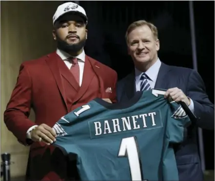  ?? MATT ROURKE — THE ASSOCIATED PRESS ?? Tennessee’s Derek Barnett, left, poses with NFL commission­er Roger Goodell after being selected by the Eagles during the first round of the NFL Draft on Thursday.