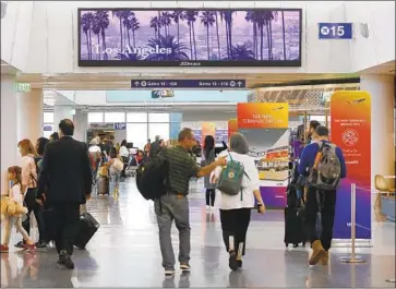  ?? Al Seib Los Angeles Times ?? THE AVERAGE domestic airfare was $343 from July through September, federal data show. Adjusted for inflation, that’s the lowest quarterly average since the U.S. began keeping track in 1995. Above, at LAX.