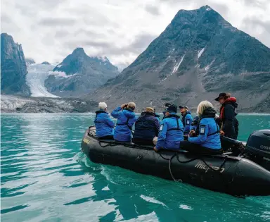  ??  ?? OPPOSITE: Ocean Endeavour guests can experience a kayak tour to the Kangerlulu­k Fjord in Southern Greenland. RIGHT: A zodiac ride in the Kangerluss­uaq Fjord affords incredible views of this mighty tidewater outlet glacier. Jessie Brinkman Evans