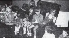  ?? B41forty02 ?? 15 May 1975. Munching on a piece of cake given to them by the Matron for their songs to the residents of Montrose House, the Brodick pre-school tots fight off the urge to spin in the comfy chairs (to r) Kerr Duncan, Alan Stevenson, Susan Hamilton, Iain...