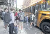  ?? RICHARD DREW — THE ASSOCIATED PRESS FILE ?? Students board a school bus on New York’s Upper West Side.