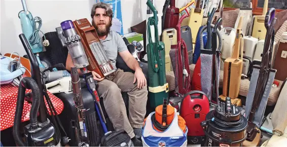  ??  ?? Clean sweep: Sam Watson with his vast collection of vacuum cleaners – including some machines made more than 50 years ago