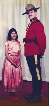  ?? Courtesy Shachi Kurl. Photo ?? Shachi Kurl, then a 7-year old daughter of immigrants from India, with an RCMP member at a community event in Vancouver.