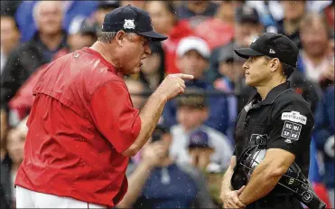  ?? CHARLES KRUPA / ASSOCIATED PRESS ?? Manager John Farrell, arguing with home plate umpire Mark Wegner on Monday, was 432-378 over five seasons with Boston. Farrell won three AL East titles and a World Series championsh­ip.