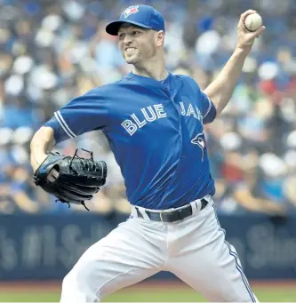  ?? FRED THORNHILL/ THE CANADIAN PRESS ?? Toronto starting pitcher J.A. Happ picked up his 13th win of the season Sunday as the Blue Jays downed the Seattle Mariners 2-0. Happ has never won 13 games in a season before.