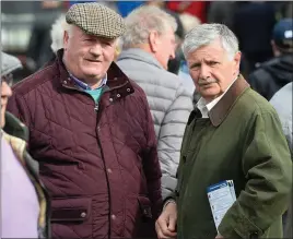  ?? Photo by Domnick Walsh ?? Tim Fitzgerald from Abbeyfeale and Des Murphy from Tarbert discussing theformatt­he Listowel Races on Monday.
