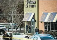  ?? SCOTT SERIO/EPA ?? Authoritie­s cordon off a Panera Bread outlet Wednesday after a shooting in Abingdon, Md., that left three dead.