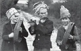  ??  ?? Children enjoying the Wren’s Day many years ago. ‘Lá an Dreoilín, Mar a Bhí’ will air on Raidió na Gaeltachta from 1.30pm on December 26.