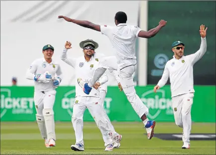  ?? Picture: REUTERS ?? ECSTATIC BOWLER: South Africa’s Kagiso Rabada celebrates with teammates after dismissing Australia’s captain, Steve Smith