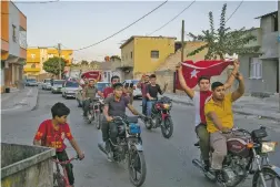  ?? MAURICIO LIMA NEW YORK TIMES ?? Residents in Akcakale, southern Turkey, celebrate after Turkish-backed Syrian fighters announced over the weekend they had taken parts of the Syrian town of Tel Abyad. President Donald Trump’s reliance on his instincts, and his relationsh­ips, led him to ignore the consequenc­es of a move that has emboldened Russia, Iran and the Islamic State.