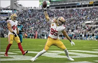  ?? PHELAN M. EBENHACK / AP ?? San Francisco tight end George Kittle celebrates after scoring a touchdown during the second half of the 49ers’ 34-3 romp Sunday over the Jacksonvil­le Jaguars in Jacksonvil­le, Fla.