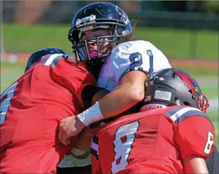  ?? BOB RAINES — DIGITAL FIRST MEDIA ?? Upper Dublin’s Malik Bootman and Max Winebrake tackle Quakertown’s Michael Terra.